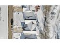 Aerial view of a house covered in snow, with cars parked nearby at 7 Watson Dr, Trafalgar, IN 46181