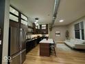 Modern kitchen with stainless steel appliances and island at 721 E North St # 1B, Indianapolis, IN 46202