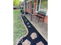 Landscaped front yard with stone pathway and mulch beds at 81 Middleton Rd, Franklin, IN 46131