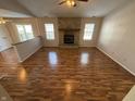 Living room with hardwood floors and a stone fireplace at 9120 Jene Ct, Indianapolis, IN 46234