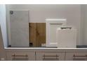 Selection of bathroom flooring, cabinets, and countertops at 14353 Bishop Birch Pl, Carmel, IN 46032