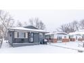 Gray house with snow covered lawn at 1704 Nelson Ave, Indianapolis, IN 46203
