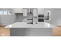 Bright kitchen featuring quartz countertops, stainless steel appliances, and a large island at 1705 Real St, Indianapolis, IN 46240