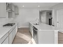 Modern kitchen with stainless steel appliances, granite countertops, and a spacious island at 1709 Real St, Indianapolis, IN 46240