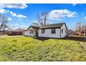 White brick ranch house with a spacious lawn and mature trees at 1904 Schwier Dr, Indianapolis, IN 46229