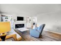 Bright living room featuring a fireplace and hardwood floors at 1904 Schwier Dr, Indianapolis, IN 46229
