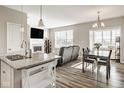 Bright living room featuring an island, fireplace, and large windows for plenty of natural light at 19629 Astoria Ave, Sheridan, IN 46069
