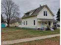 House exterior showcasing a side view and yard at 325 S Market St, Thorntown, IN 46071