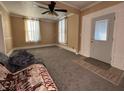 Spacious living room featuring gray carpeting and a view into another room at 325 S Market St, Thorntown, IN 46071