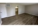Spacious living room with wood-look floors and neutral walls at 4219 E 43Rd Ct, Indianapolis, IN 46226