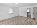 Living room with hardwood floors and kitchen view at 555 N Sadlier Dr, Indianapolis, IN 46219