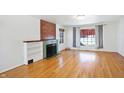 Hardwood floors and a fireplace in this living room at 6072 Meridian St W Dr, Indianapolis, IN 46208