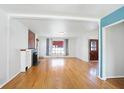 Spacious living room featuring hardwood floors and fireplace at 6072 Meridian St W Dr, Indianapolis, IN 46208