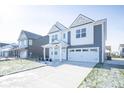 Two-story home with gray siding, white accents, and a two-car garage at 8870 Walker St, Fortville, IN 46040
