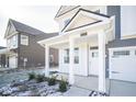 White front porch with columns and a white door at 8870 Walker St, Fortville, IN 46040