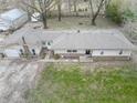 A beautiful aerial view of this ranch-style home highlighting the roof and landscaping at 9400 N Bishop Ln, Mooresville, IN 46158