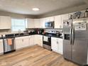 Well-lit kitchen featuring stainless steel appliances and sleek countertops at 9812 W 900 N Rd, Elwood, IN 46036