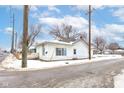 Cozy bungalow with a snow-covered yard at 1363 & 1367 S Belmont Ave, Indianapolis, IN 46221
