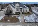 Spacious two-story house with white brick exterior and a landscaped yard at 14516 Copper Ridge Dr, Fishers, IN 46040