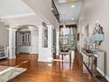 High-ceiling living room with hardwood floors, large windows, and a chandelier at 14516 Copper Ridge Dr, Fishers, IN 46040