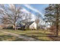 House exterior showcasing landscaping and curb appeal at 14807 Beacon Blvd, Carmel, IN 46032