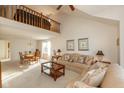 Open living and dining area with high ceilings and loft at 14807 Beacon Blvd, Carmel, IN 46032