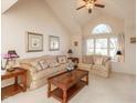 Spacious living room featuring vaulted ceilings and plush sofas at 14807 Beacon Blvd, Carmel, IN 46032