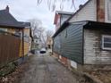 View down a residential alleyway with houses on either side at 1601 Spann Ave, Indianapolis, IN 46203