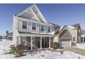 Two-story house with brick and siding, covered porch, and two-car garage at 1630 Lavender Ln, Greenwood, IN 46143