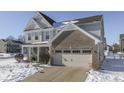 Two-story house with brick and siding, covered porch, and two-car garage at 1630 Lavender Ln, Greenwood, IN 46143