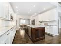 Modern kitchen with white cabinets, granite counters and island at 3150 Beach Blvd, Cicero, IN 46034