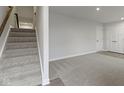 Unfinished basement with carpeted floor and stairs leading upstairs at 6322 Loraine Dr, Brownsburg, IN 46112