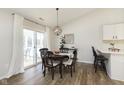 Cozy dining area with table, chairs, and sliding door to patio at 6615 Rushing, Noblesville, IN 46062