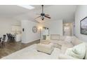 Spacious living room with hardwood floors, modern furnishings, and a large sectional sofa at 6615 Rushing, Noblesville, IN 46062