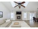 Bright living room with vaulted ceilings, fireplace, and neutral decor at 6615 Rushing, Noblesville, IN 46062