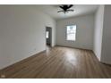 Spacious living room featuring hardwood floors and ceiling fan at 1256 Kappes St, Indianapolis, IN 46221