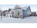 Two-story house with gray siding and brick accents, in a winter setting at 2364 Eagle Ave, Plainfield, IN 46168