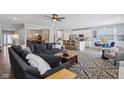 Open-concept living room with a sectional sofa, a fireplace and kitchen views at 2364 Eagle Ave, Plainfield, IN 46168