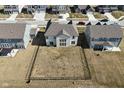 Aerial view of a spacious backyard with a black fence, surrounded by neighboring homes at 4061 Omaha Dr, Bargersville, IN 46106