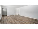 Spacious living room featuring hardwood floors and neutral walls at 4725 S Rural St, Indianapolis, IN 46227