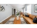 Open concept living and dining area with hardwood floors and neutral colors at 6005 Ralston Ave, Indianapolis, IN 46220