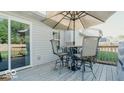 Relaxing deck with patio furniture and umbrella at 825 Queensgate Dr, Greenwood, IN 46143