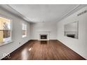 Bright living room featuring hardwood floors and a fireplace at 9210 Briarclift Rd, Indianapolis, IN 46256