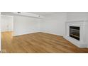 Living room with hardwood floors and corner fireplace at 10322 Buell Ct, Avon, IN 46123
