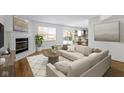 Spacious living room featuring a fireplace and L-shaped sofa at 10322 Buell Ct, Avon, IN 46123