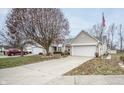 Brick ranch home with attached garage and driveway at 10832 Harness Way, Indianapolis, IN 46239