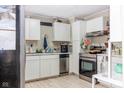 White cabinets, stainless steel appliances, and marble countertops at 1405 Sheek Rd, Greenwood, IN 46143