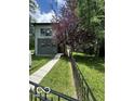 Beautiful two-story home with a walkway leading to the front door and a black fence at 1656 Roosevelt Ave, Indianapolis, IN 46218