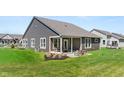 This home features a covered patio with nice backyard for outdoor enjoyment at 19357 Sumrall Pl, Westfield, IN 46074