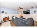 Cozy living room featuring a sectional sofa and large TV at 2214 Pleasant St, Indianapolis, IN 46203